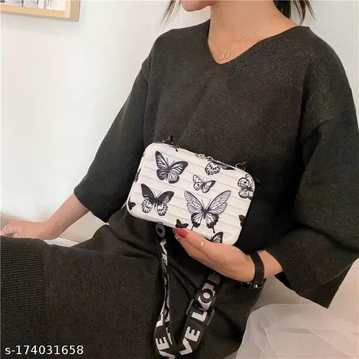 Woman's detachable shoulder strap convertible cosmetic box bag, patterned fabric with black and white butterflies