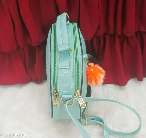 Light blue crossbody purse with tassel detail, likely featuring a zip closure and multiple pockets