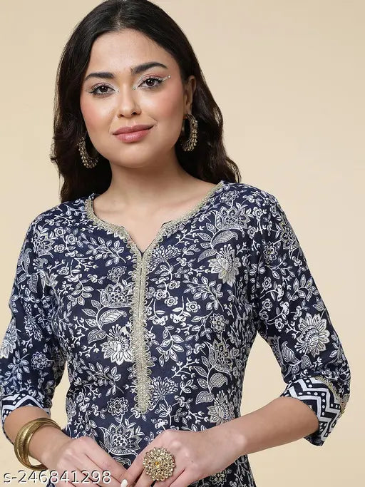 Printed cotton blend kurta plazzo set with floral print, three-quarter sleeves, and white base. Perfect for Indian festivals or summer events, originating from India