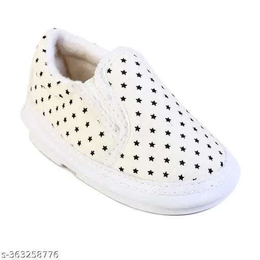 White slippers with polka dots and a bow on top