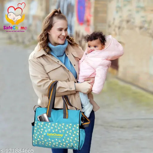 A woman carrying a sky blue diaper bag on her shoulder, smiling and walking down the street