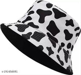 Stylish reversible bucket hat, black and white cow print design