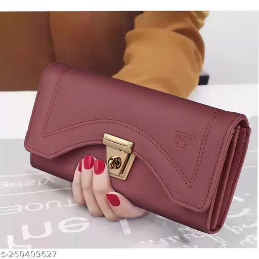 Peach leather clutch wallet with gold accents, flap closure
