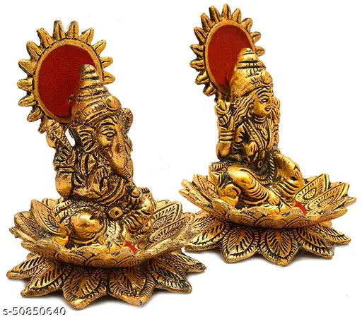 Gold metal idol statues of Lord Laxmi and Ganesh, each on a lotus flower. Art decoration for home. Size 8 x 8 x 10 cm. Vibrant religious showpiece