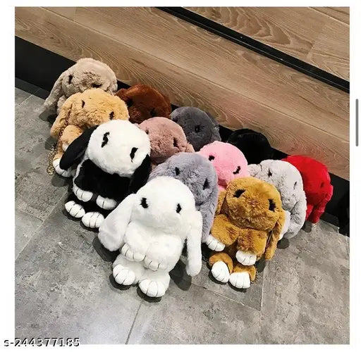 This is an image of a collection of plush animal bags. The bags feature different designs, with one resembling a rabbit and another looking like a bunny. They are arranged neatly on a floor, possibly for display or sale. There's no clear indication of the material, capacity, or specific product features such as closure type or strap length