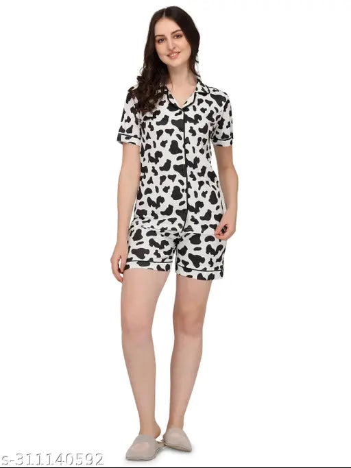 Black & White Cow Printed Women's Night Suit Set: Polycotton shirt and shorts with short sleeves, slip-on closure, elasticated waistband, pocket, and a drawstring closure. Comfortable and attractive pyjamas from India