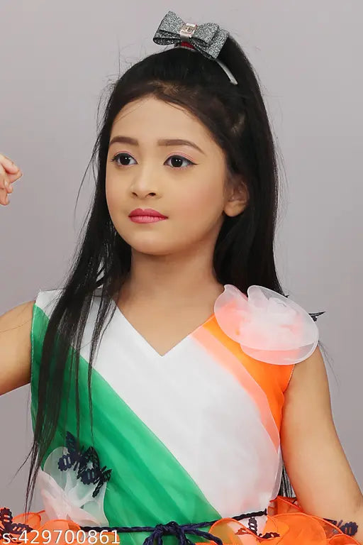 A young girl wearing a patriotic frock with tricolor colors on the lower half, designed for special occasions like school events and national celebrations