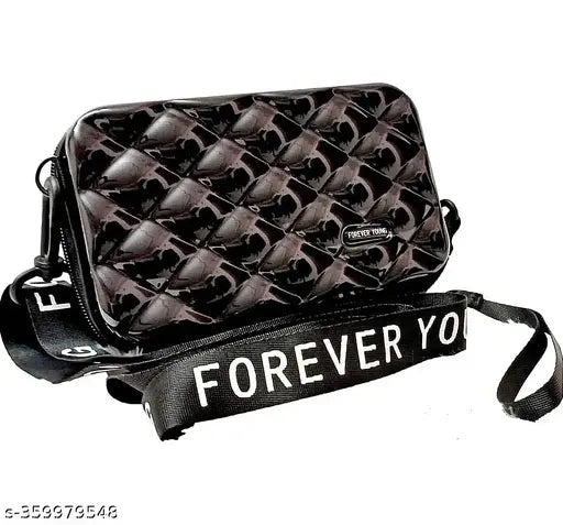 Fashionable black designer suitcase with patterned shoulder strap