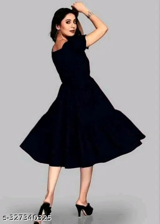 Black rayon short-sleeved party dress for women, solid design on mannequin