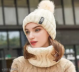 Brown knit beanie with white pompom