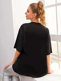 Stylish oversized black T-shirt for women with a scoop neck