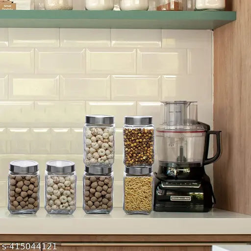 Six transparent cube glass jars with silver lids, ideal for kitchen storage.