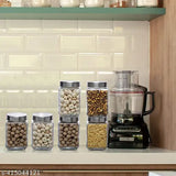 Six transparent cube glass jars with silver lids, ideal for kitchen storage.