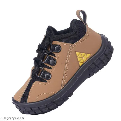 Tan kids training shoe, black laces, rubber soles