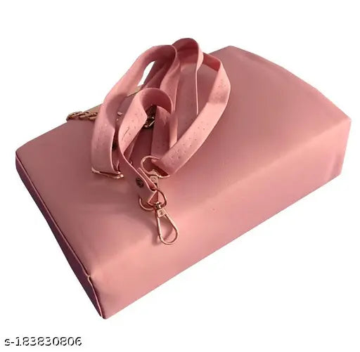 A pink slingbag with a rectangular box pattern and two shoulder straps