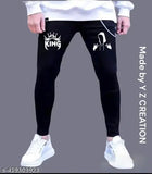 Black denim jeans with white text reading 'KING' and a symbol resembling a crown, featuring a drawstring waistband and two side pockets