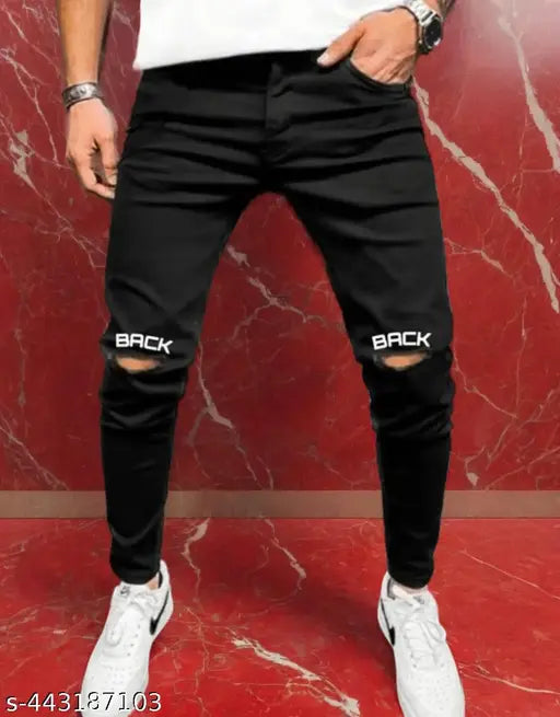 Black printed jeans with side slits and distressed details