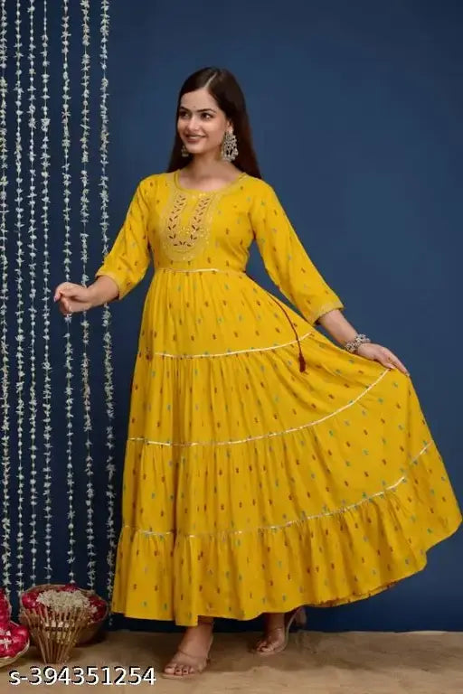 Super yellow rayon kurta with four-tier embroidery, three-quarter sleeves, printed combo. Single size options available for S-XXXL. Indian fashion apparel