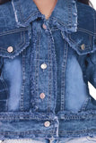 A blue denim jacket with a unique, flared design and a statement collar