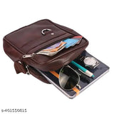 Black leatherette sling bag with waterproof feature, side pockets, adjustable strap