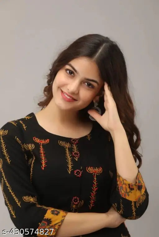 Black and gold floral print woman's outfit