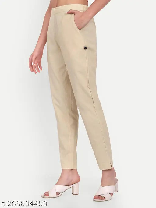 Cotton beige pants with elasticated waistband, solid design, and two pockets. Made in India (size 46 - 39L x 52H)