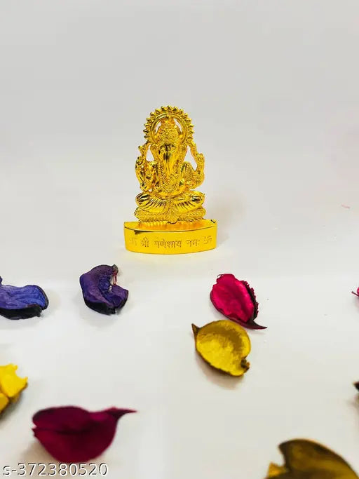 Gold metal Ganesh idol, intricately hand-crafted, 5cm x 7cm x 1cm, celebrating Indian culture and tradition