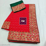 Red bandhani embroidered saree with intricate design, bordered by a red pattern