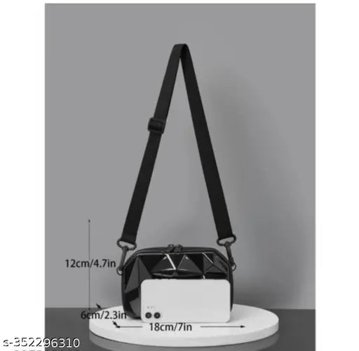 Black leather crossbody bag with adjustable strap, small front pocket