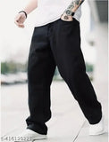 Loose fit black denim pants with rolled up cuffs, casual men's style