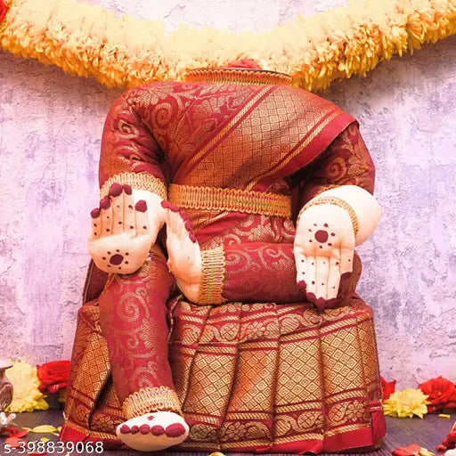 Red and gold sari, fabric idol, Varalakshmi decoration