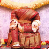 Red and gold sari, fabric idol, Varalakshmi decoration