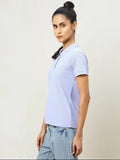 Printed blue polyester tech sport t-shirt for women, UPF50+ sun protection, Odourfree, TechnoGuard, and 2-way stretch. Soft & smooth anti-static fabric, perfect for active lifestyles. Model (5'7') wearing size M, origin India