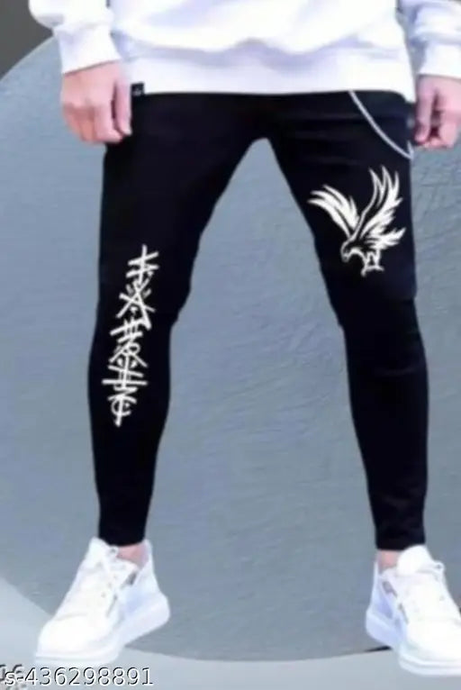 Man wearing black skinny jeans with a large white eagle print on each leg