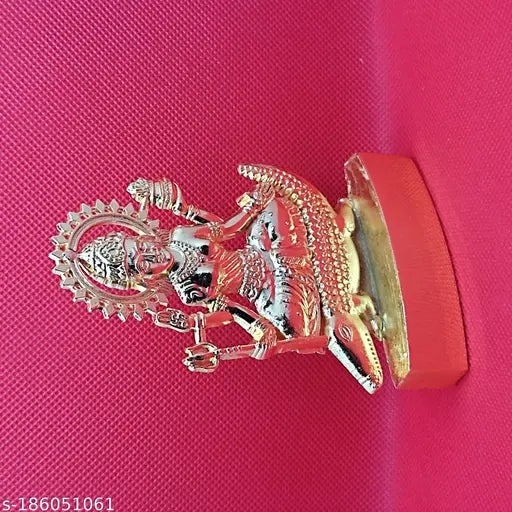 Golden metal religious icon with intricate detailing deity