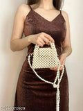 A woman wearing a sparkly dress holds a decorative white button clutch, suggesting a party accessory