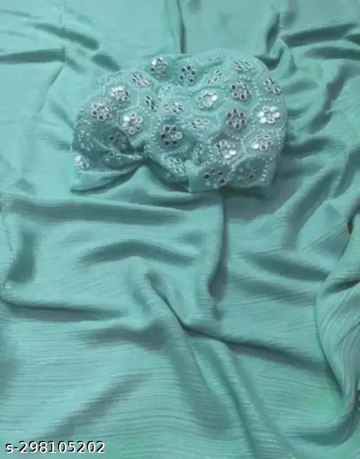 Green chiffon fabric with large flower embellishment