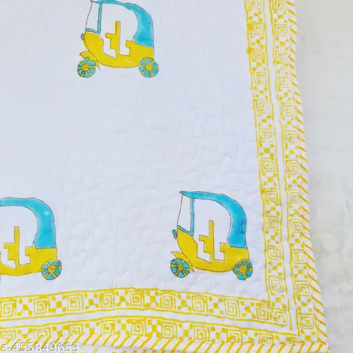 Quilted cotton bedcover with block print design, includes multicolored motifs and text