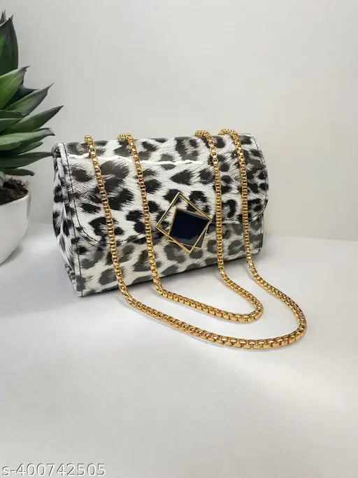 Fashionable women's sling bag with black and white leopard print design, gold chain strap, adjustable crossbody straps