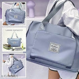 Large expandable waterproof travel duffle bag, black & blue colors, multiple compartments and pockets