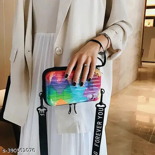Multicolored sling bag with a white background and black strap