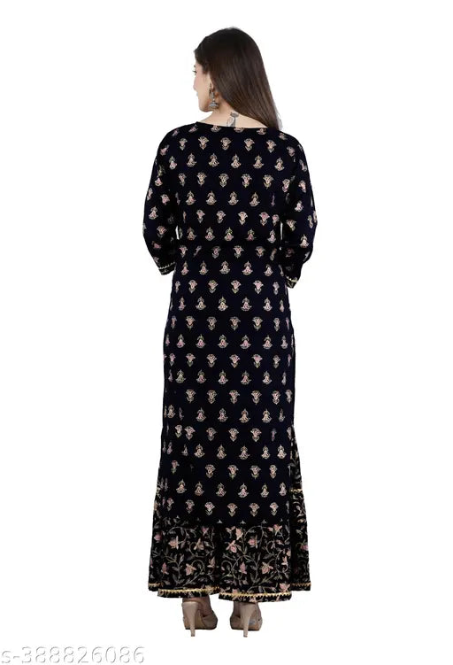 The image features a dark blue kurta with a gold printed pattern, long sleeves, and a high neckline. It is displayed on a mannequin against a white background