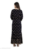 The image features a dark blue kurta with a gold printed pattern, long sleeves, and a high neckline. It is displayed on a mannequin against a white background