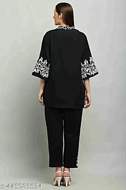 Gorgeous look black coord set with heavy embroidery for women. Viscose rayon kurta and palazzos, three-quarter sleeves. Single size options available
