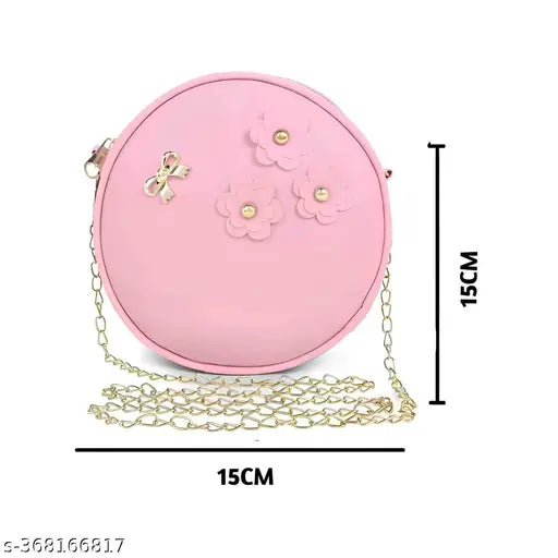 Womens pink handbag with crossbody strap, black accents, chain detail