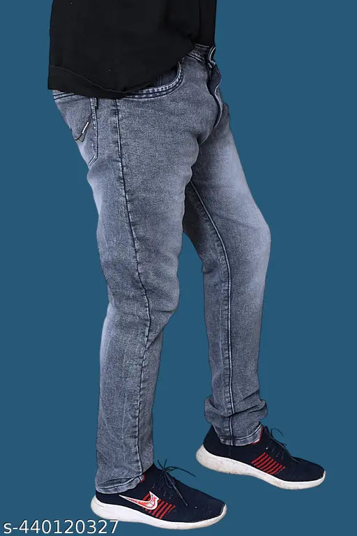 Grey men's denim jeans with blue sneakers