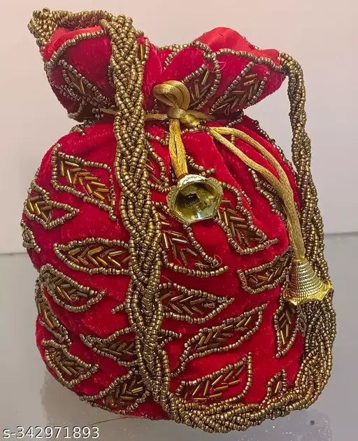 Red and gold embellished bag with a tassel on top, possibly for carrying small items or coins