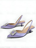Purple satin high heel shoes with rhinestones, pointy toes, and ankle straps