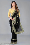 Black and gold embroidered saree with mirror work