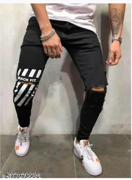 Men's black denim designer knee-cut jeans, solid fit with size options including 28, 30, 32, 34, 36 (US). Indian origin